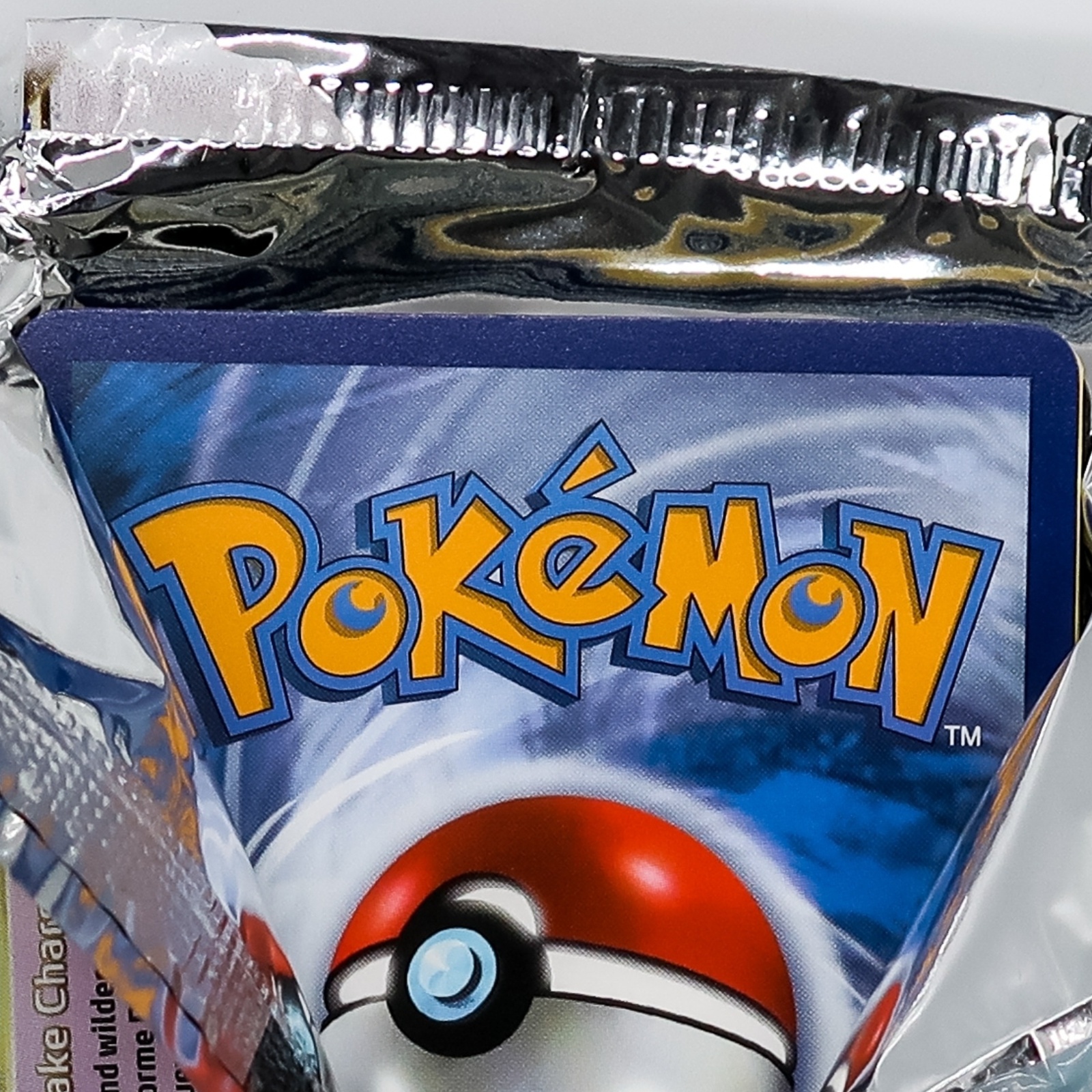 A pack of Pokémon cards being opened