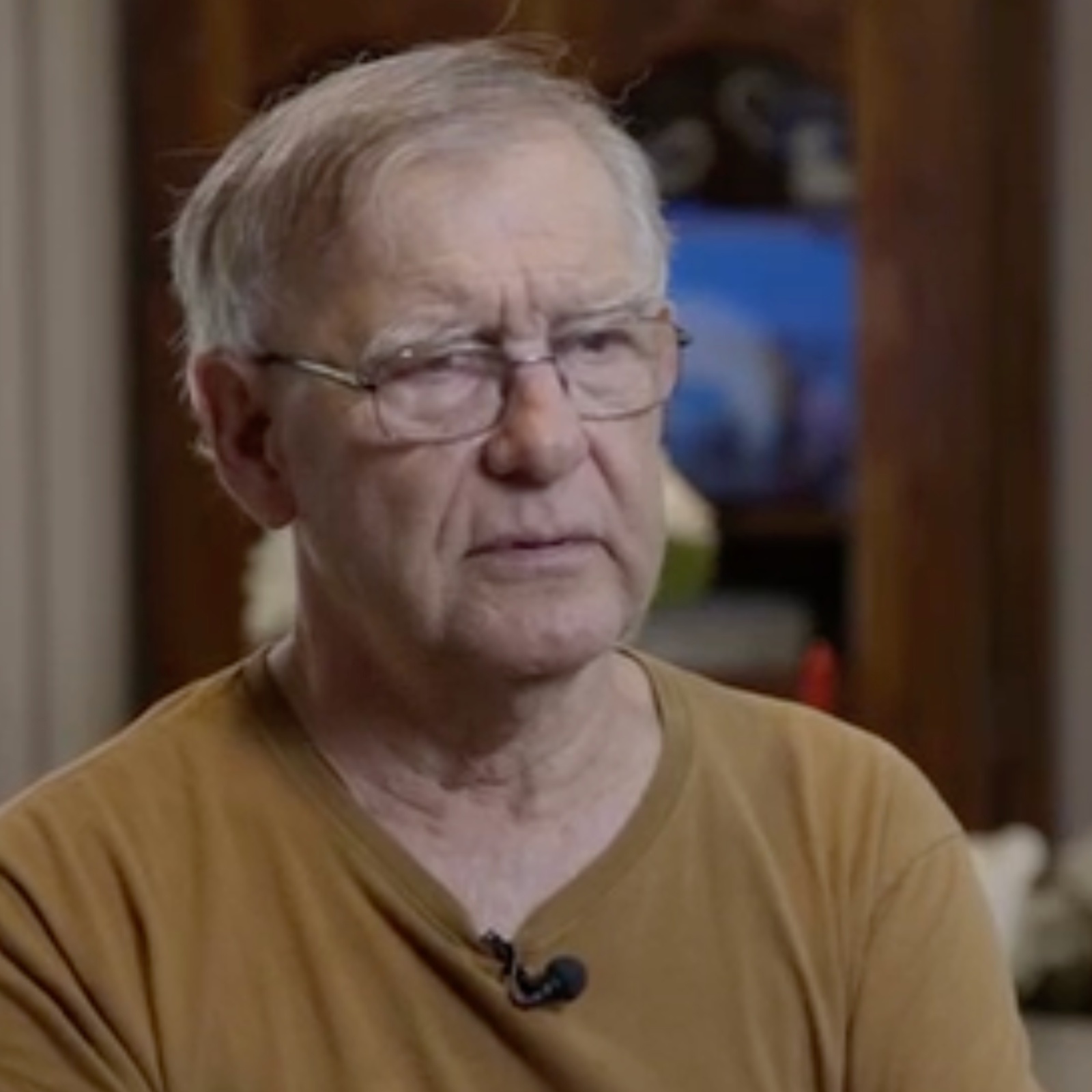 Photo of Tom Saylor, who says he bought an extended auto warranty he didn’t need and is still fighting to get a refund, and his truck.