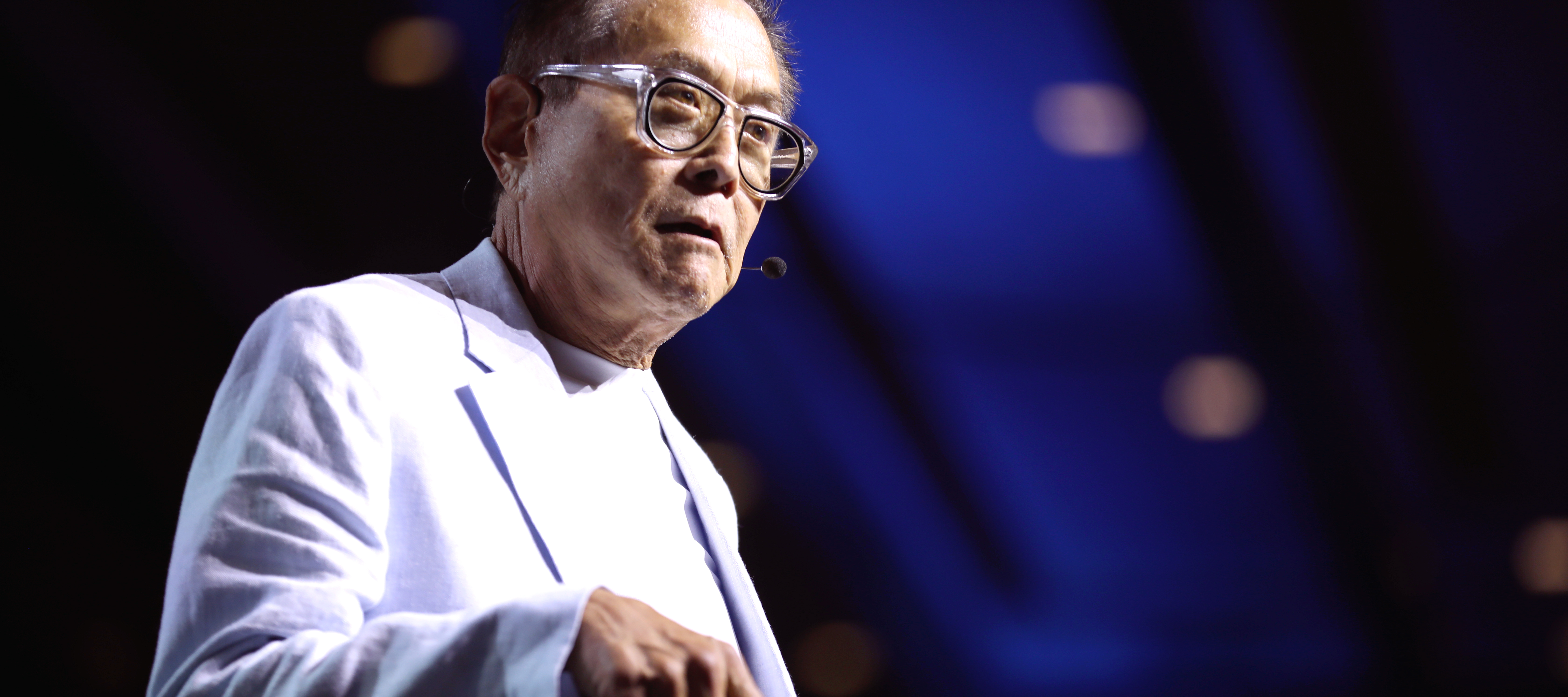 Robert Kiyosaki speaking with attendees at the 2024 FreedomFest at Caesars Forum Conference Center in Las Vegas, Nevada.