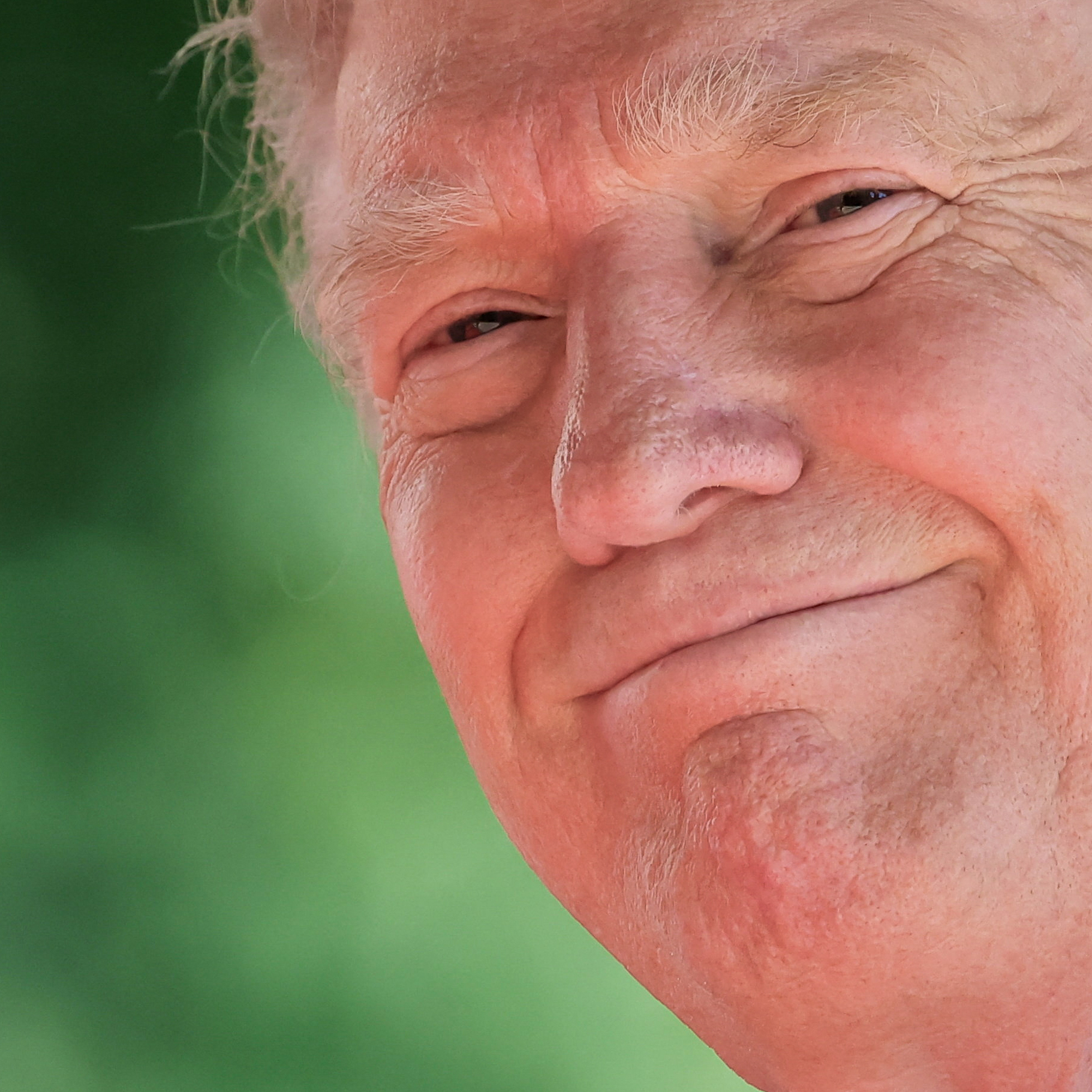 A closeup of U.S. President Donald Trump, smiling.