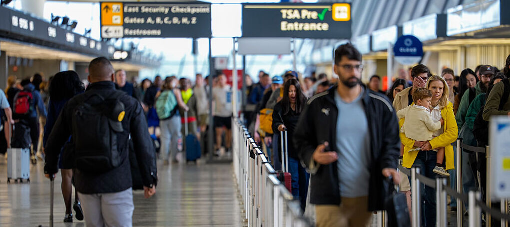 U.S. travelers move through Washington Dulles International Airport.