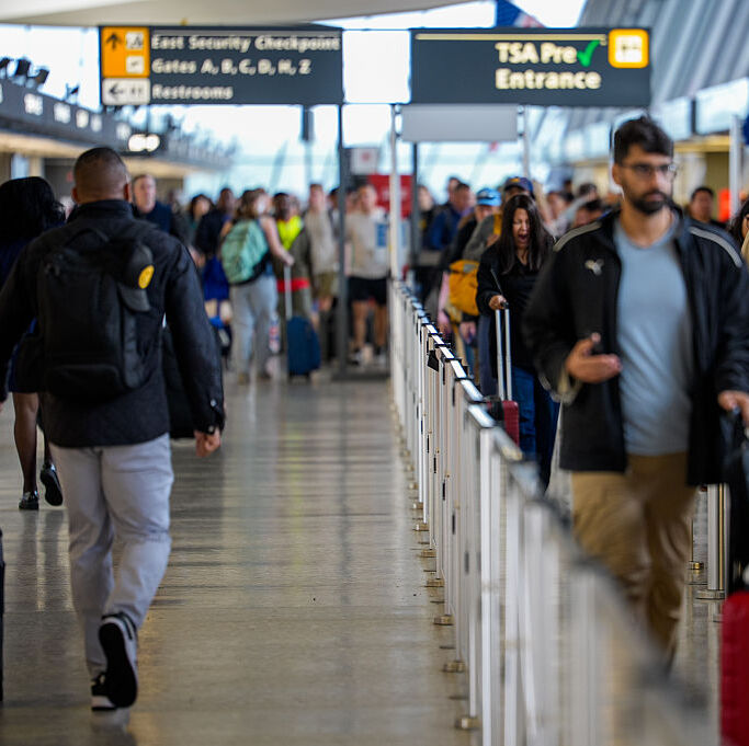 U.S. travelers move through Washington Dulles International Airport.