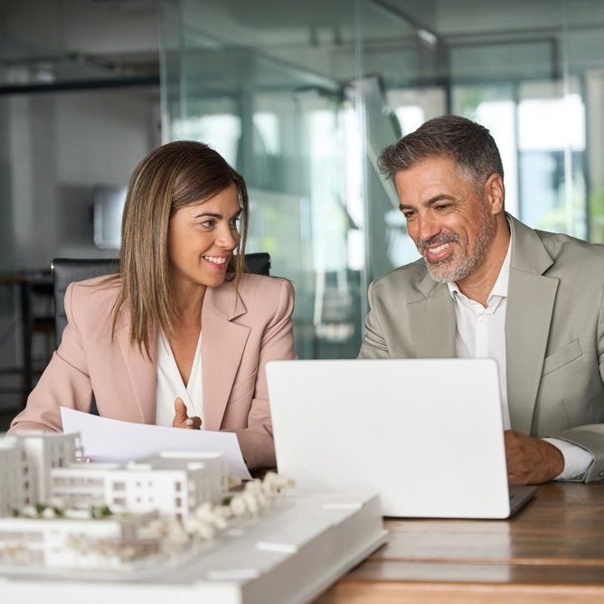 A photo of two real estate investors