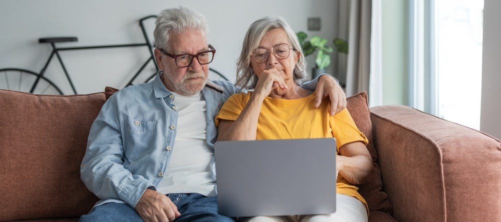 A photo of a retired couple reviewing their finances