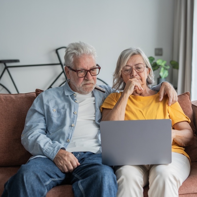 A photo of a retired couple reviewing their finances