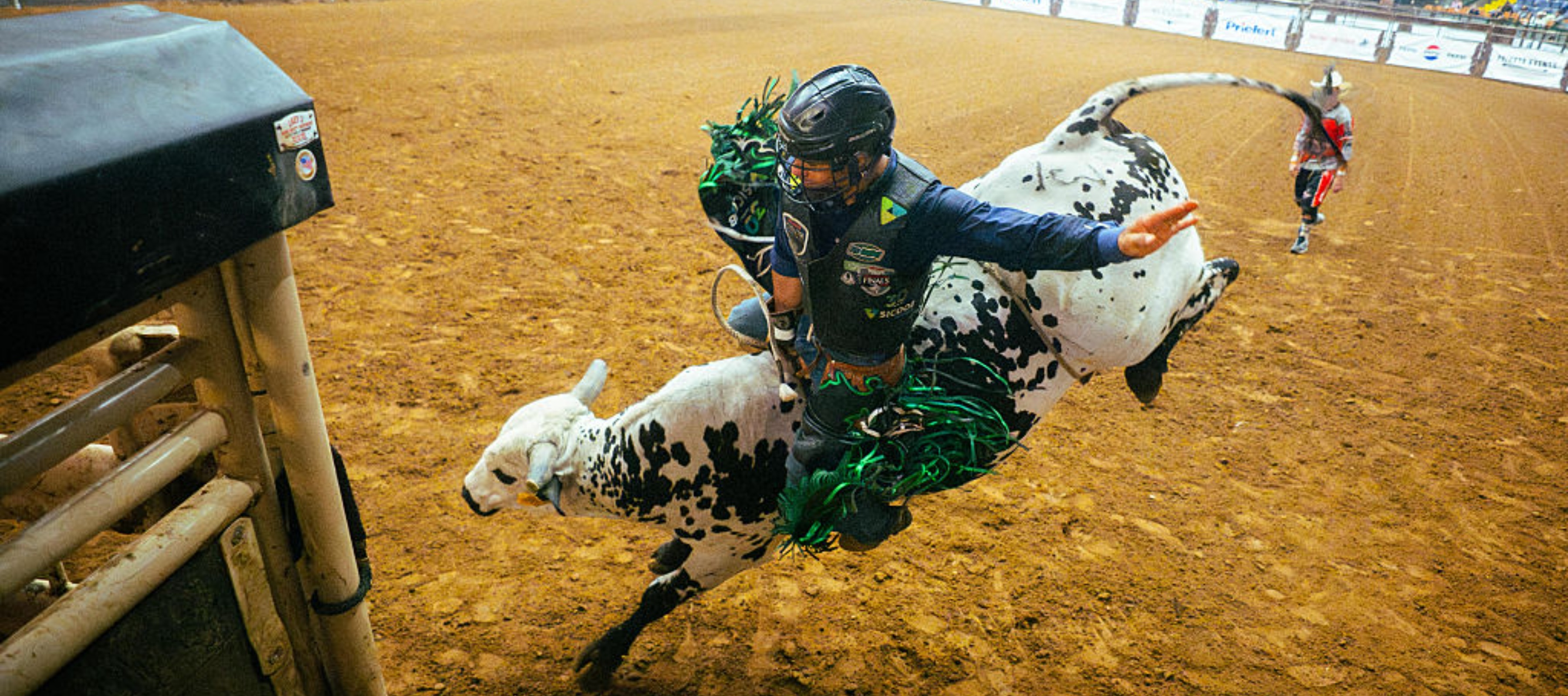 A roughstock rider on a bull at the rodeo in Texas.