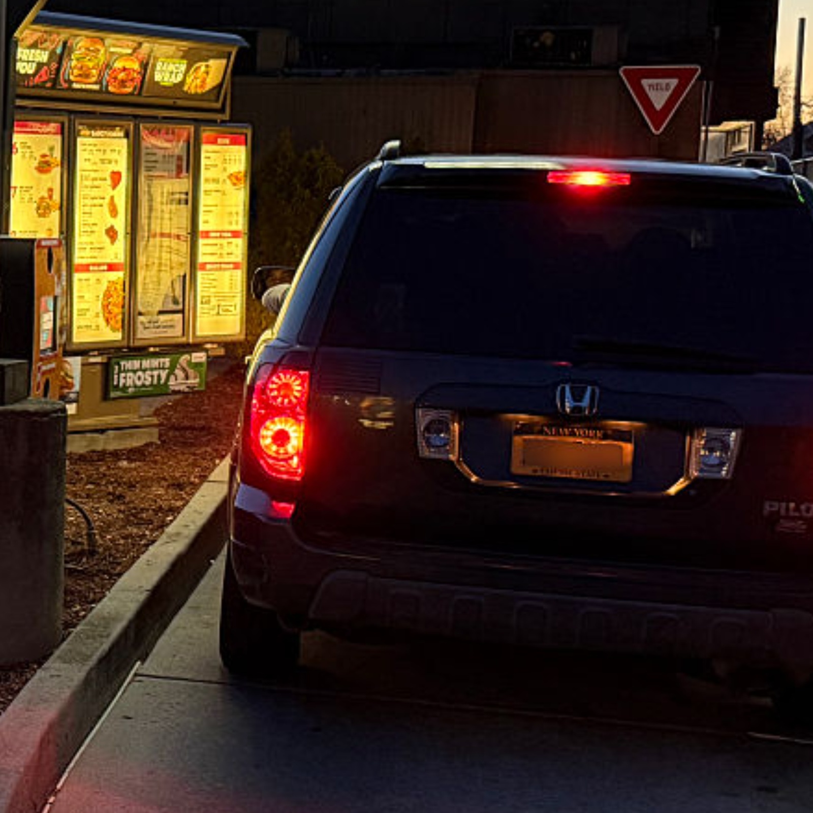 Drive Thru breakfast menu display at night, Wendys fast food restaurant.