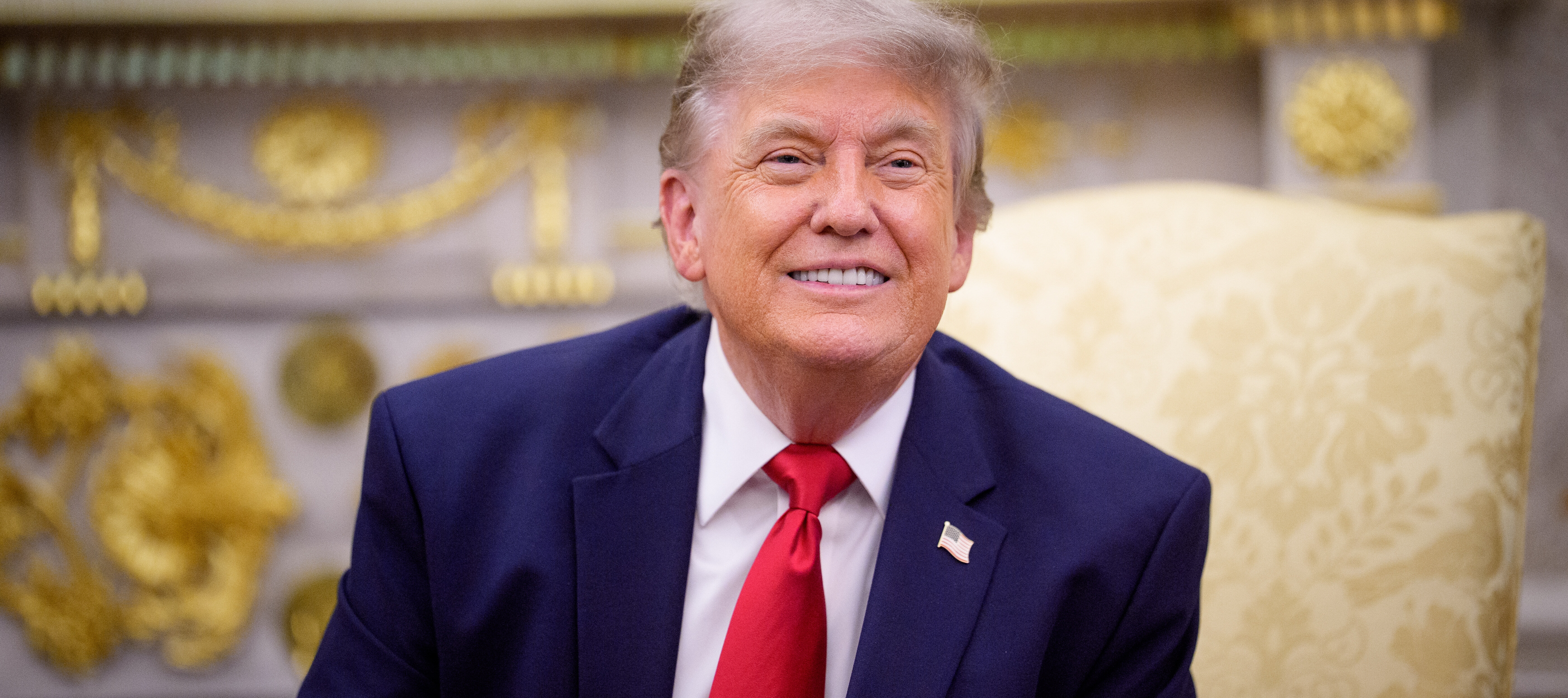 President Trump speaks with reporters in the Oval Office.