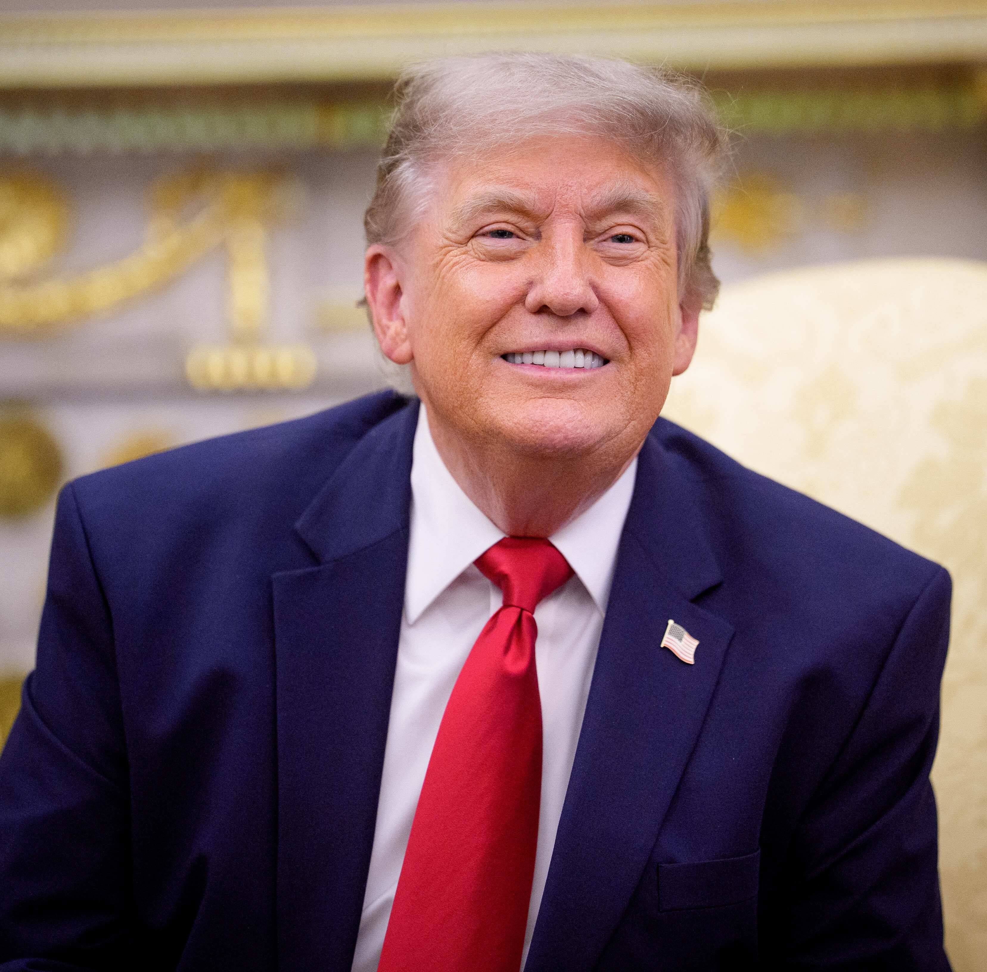 President Trump speaks with reporters in the Oval Office.