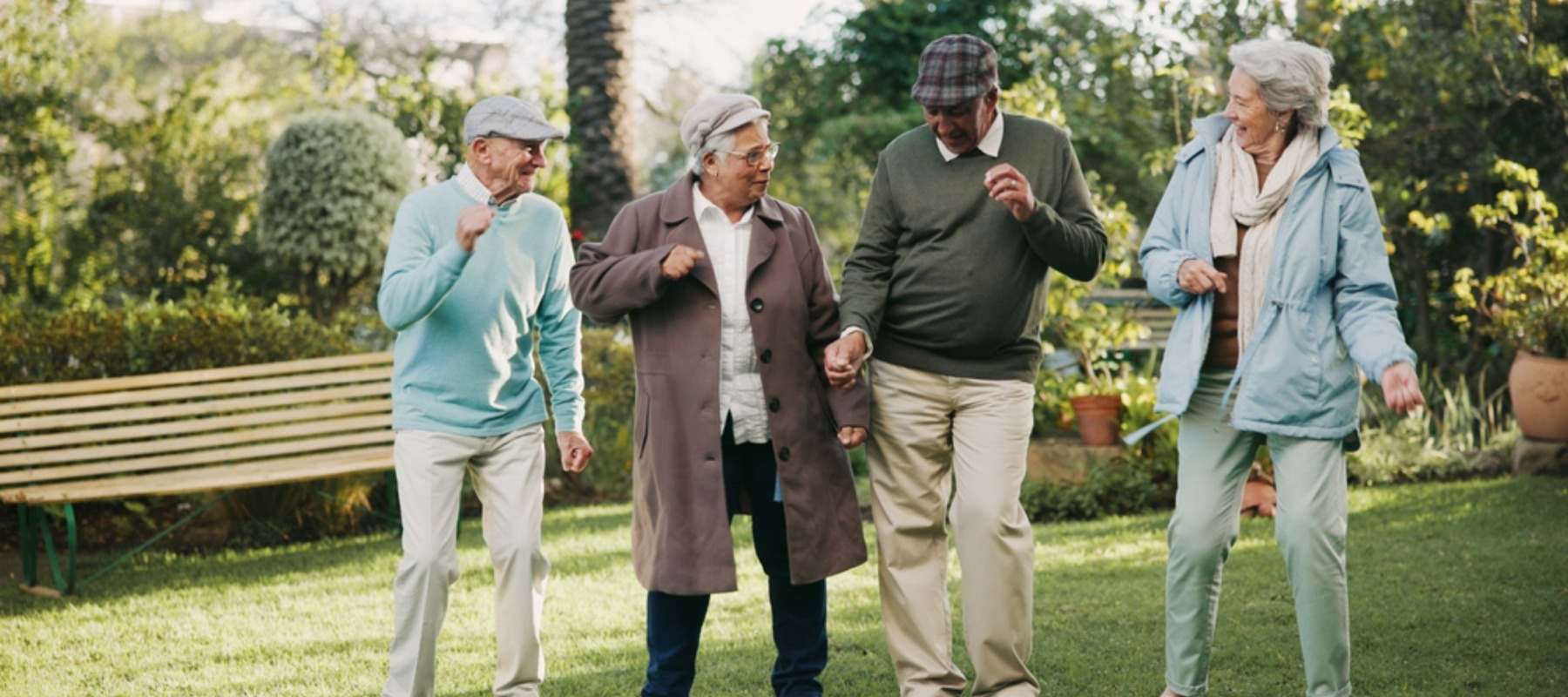 Photo of several seniors dancing outside