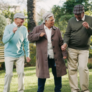 Photo of several seniors dancing outside
