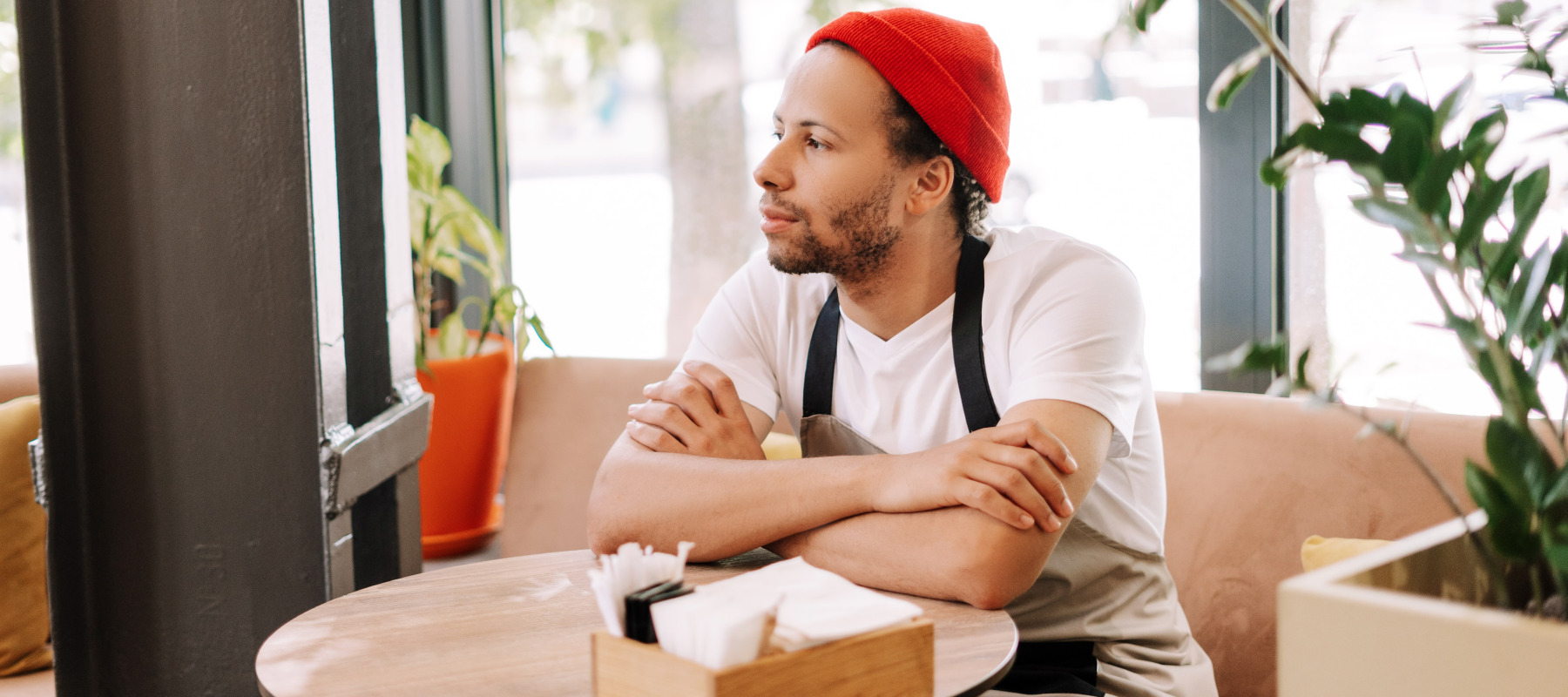 Barista sitting at table on break