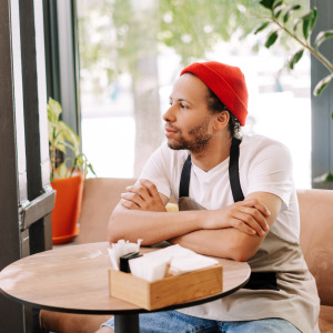 Barista sitting at table on break