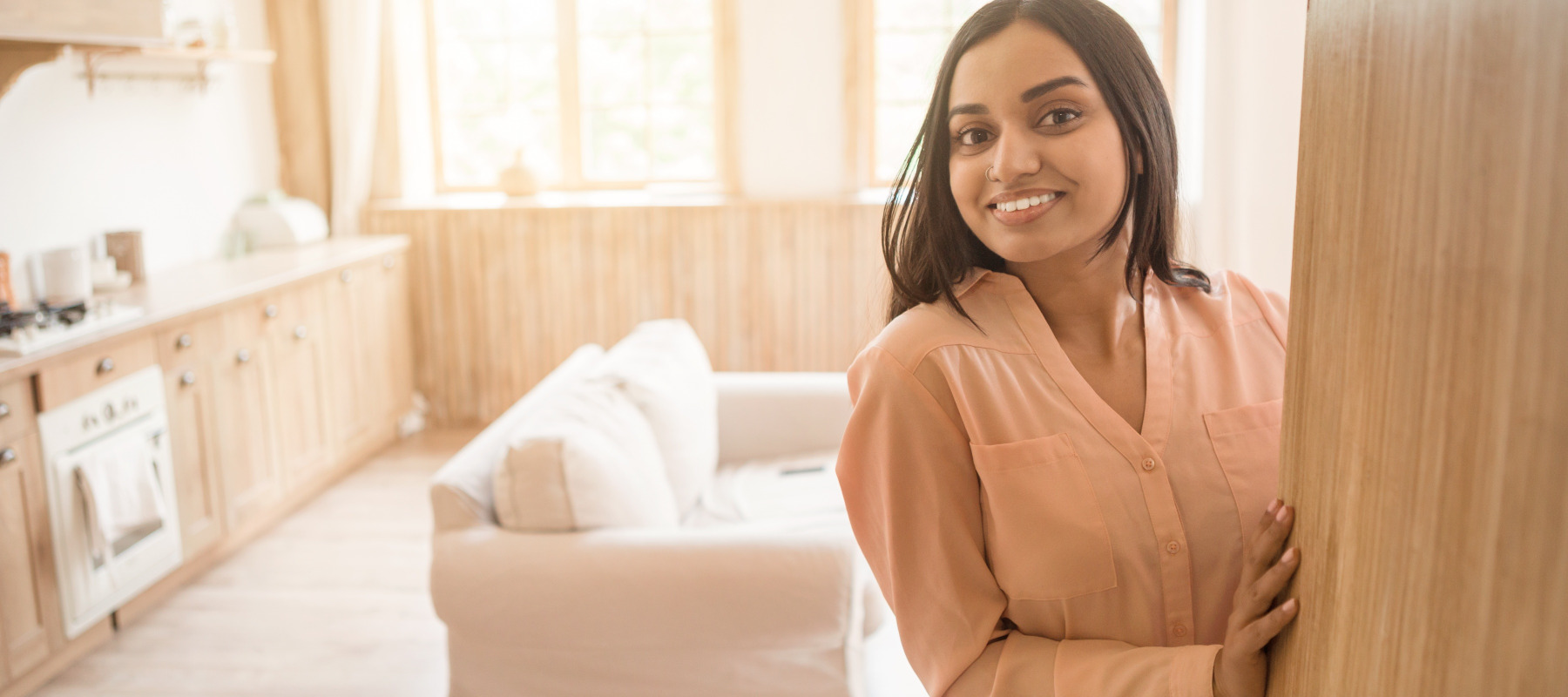 A woman in her apartment.