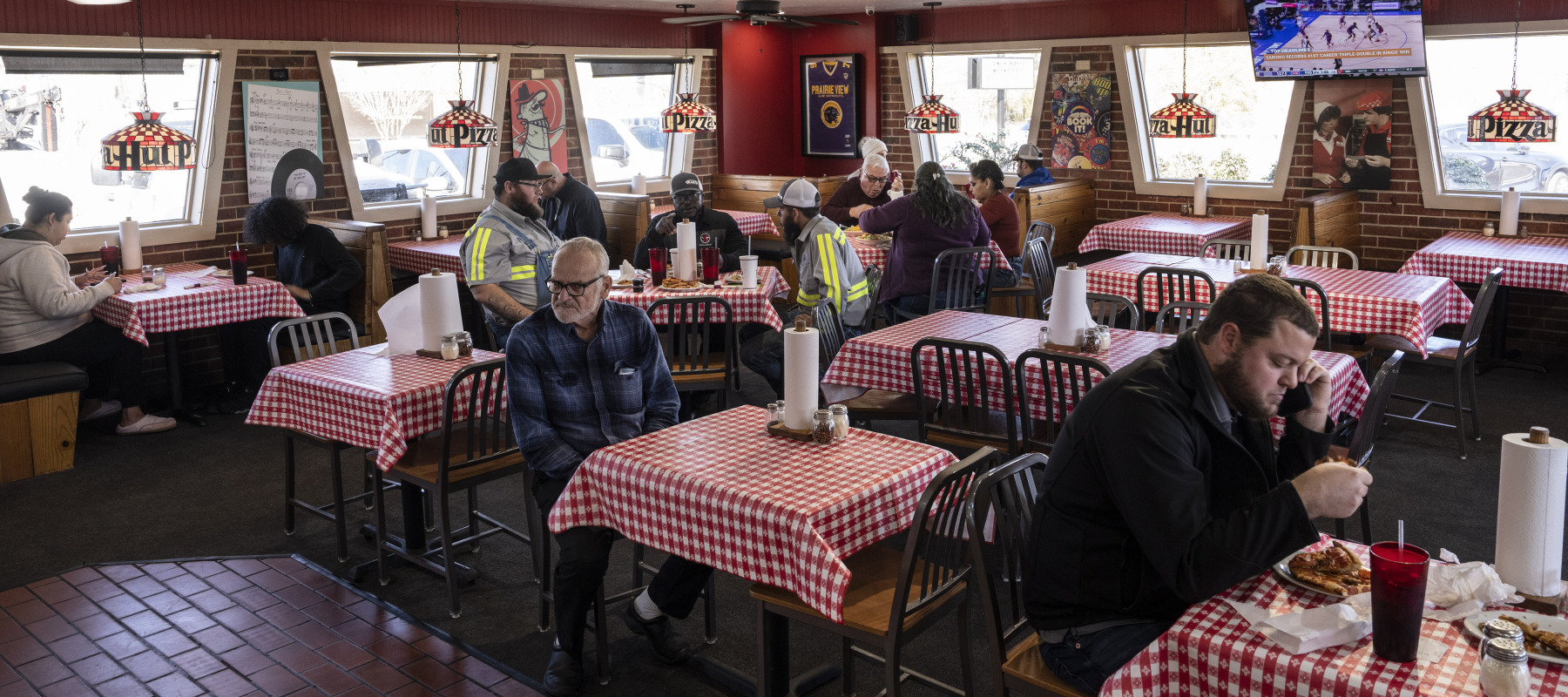 Customers eating at an old-school dine-in Pizza Hut.