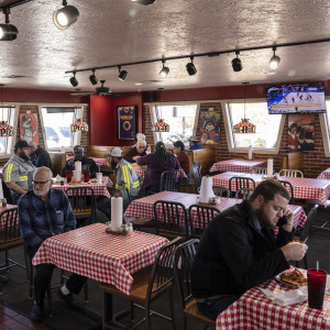 Customers eating at an old-school dine-in Pizza Hut.