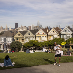 Visitors enjoying their time at Alamo Square Park in San Francisco.