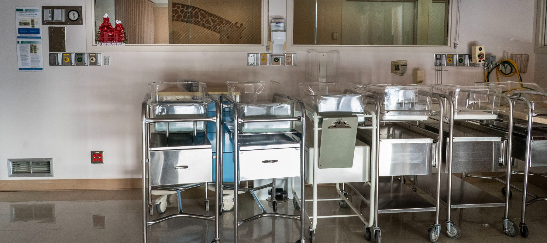 Empty infant beds sit gathered in a corner in a quiet maternity ward at rural Madera Community Hospital.