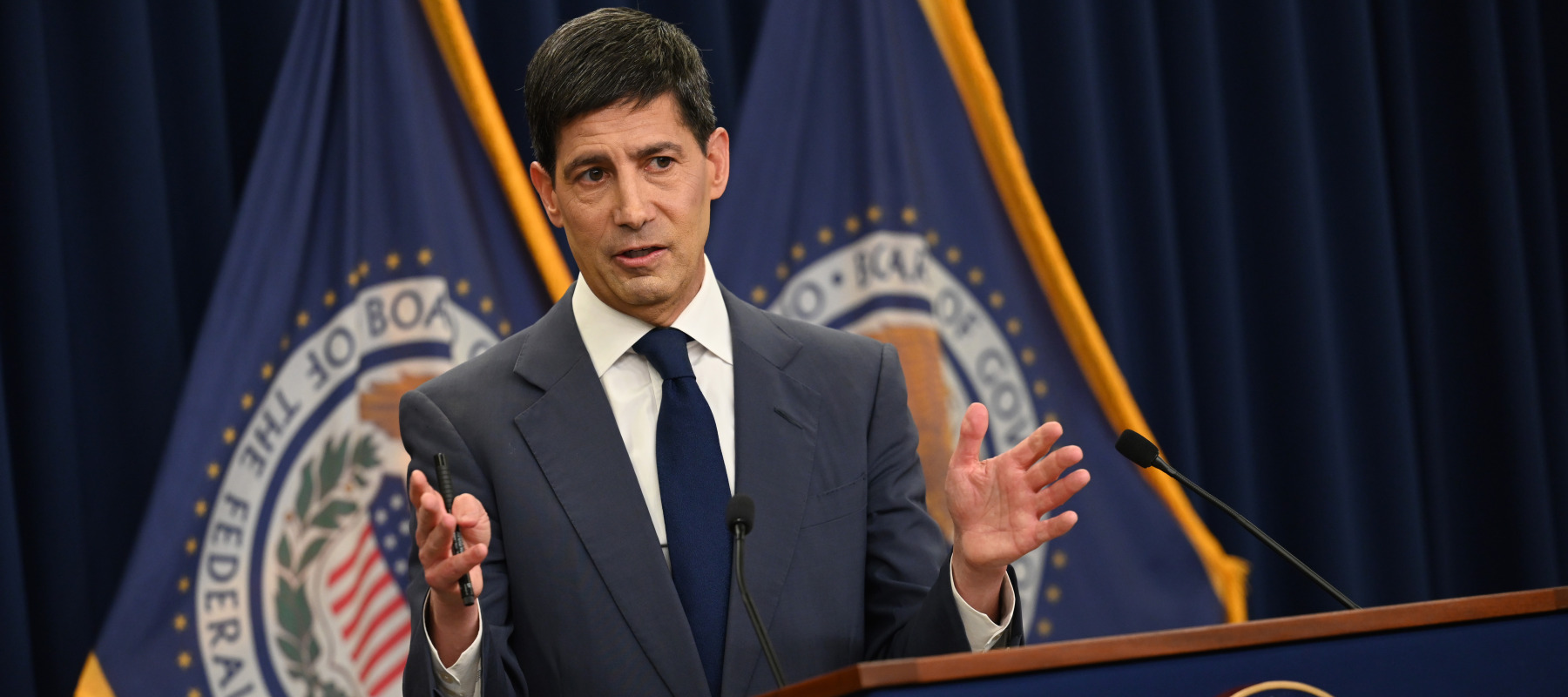 Kevin Warsh speaks at a press conference.