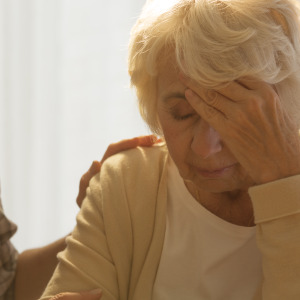 woman consoling senior woman