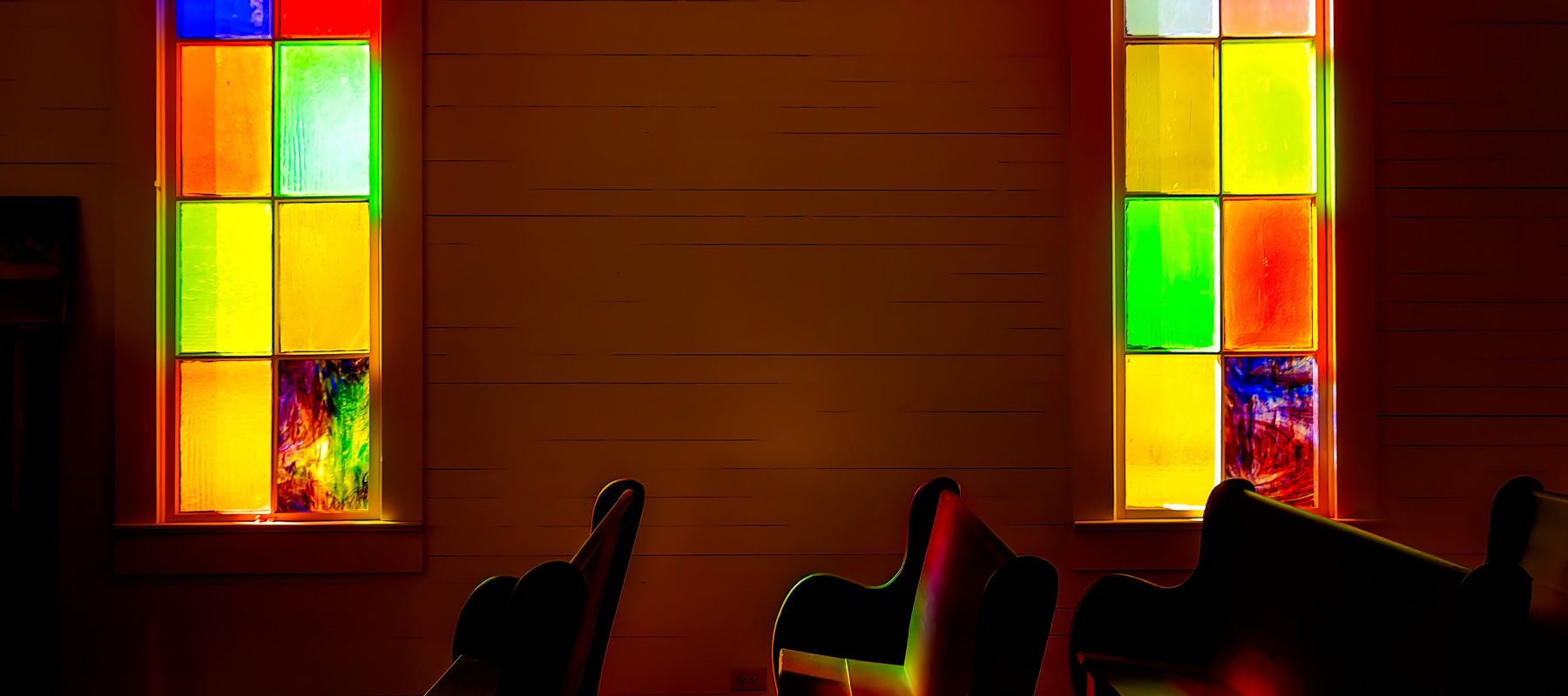 A photo of a stained-glass church windows