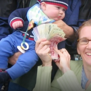 Leo Bruce and his parents at a baseball game in 2004.