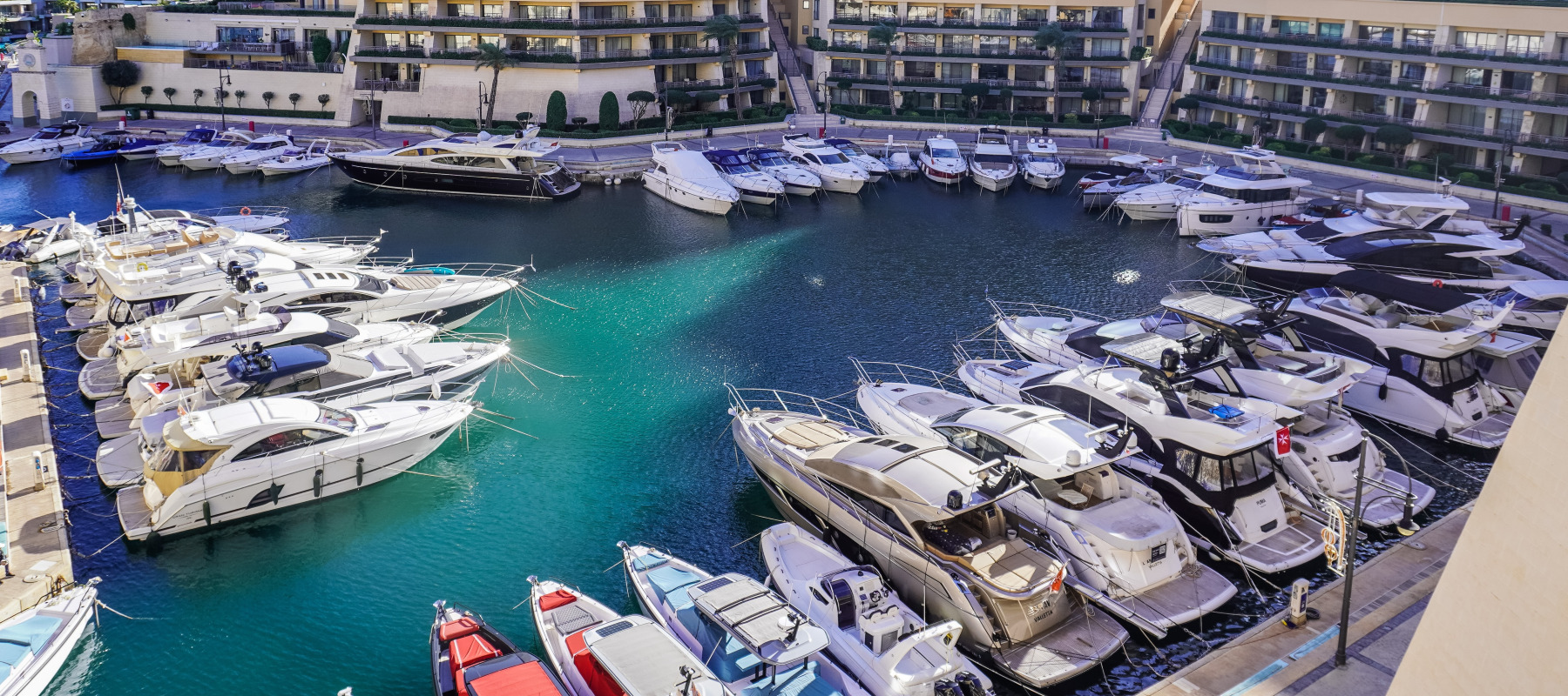 A view of the Portomaso marina with luxury yachts is seen in St. Julian's, Malta, in December 2024