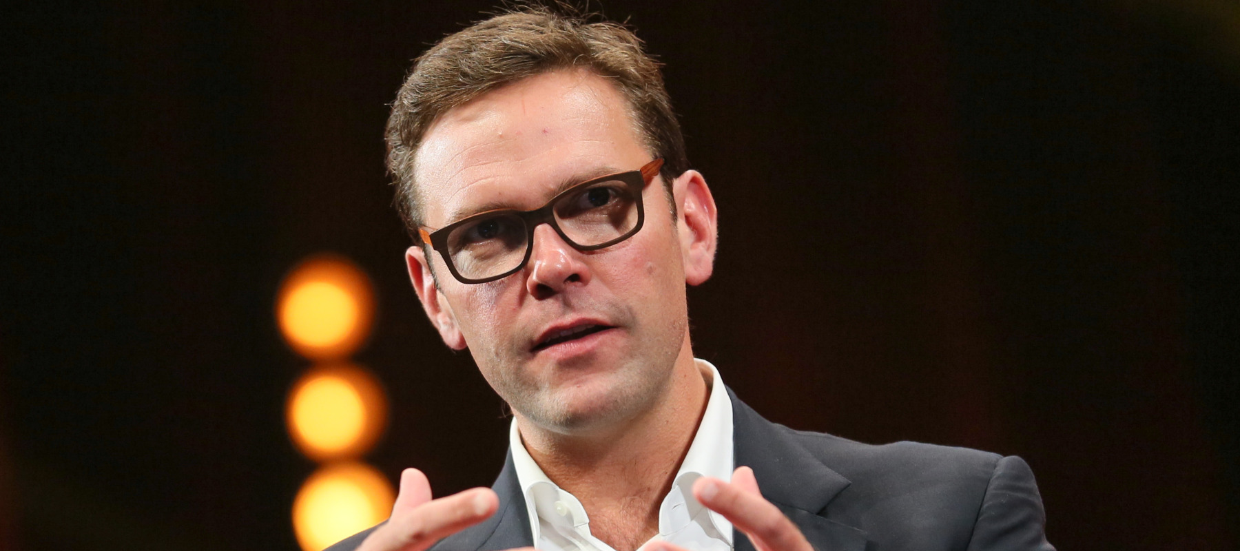 James Murdoch, then co-COO of 21st Century Fox, speaks at a 2014 event.