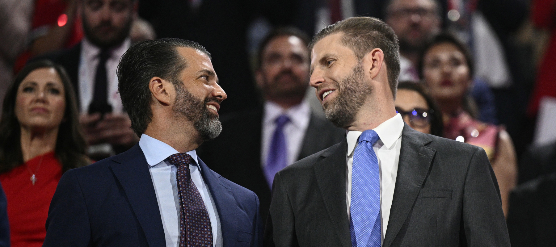 Sons of U.S. President Donald Trump, Eric Trump and Donald Trump Jr., attend the first day of the 2024 Republican National Convention at the Fiserv Forum in Milwaukee, Wisconsin.