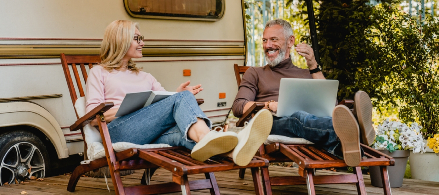 Photo of two people sitting in RV park