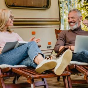 Photo of two people sitting in RV park