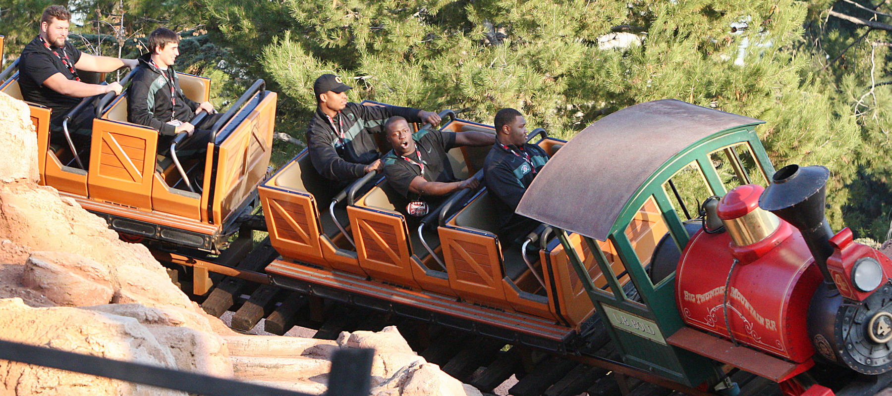 People ride Big Thunder Mountain roller coaster at Disneyland.