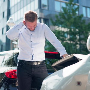 Man suffering from neck pain after a car accident.