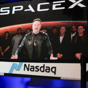 SpaceX CEO Elon Musk, displayed on a screen remotely from SpaceX headquarters in Starbase, Texas, speaks before the launch of SpaceX's initial public offering .