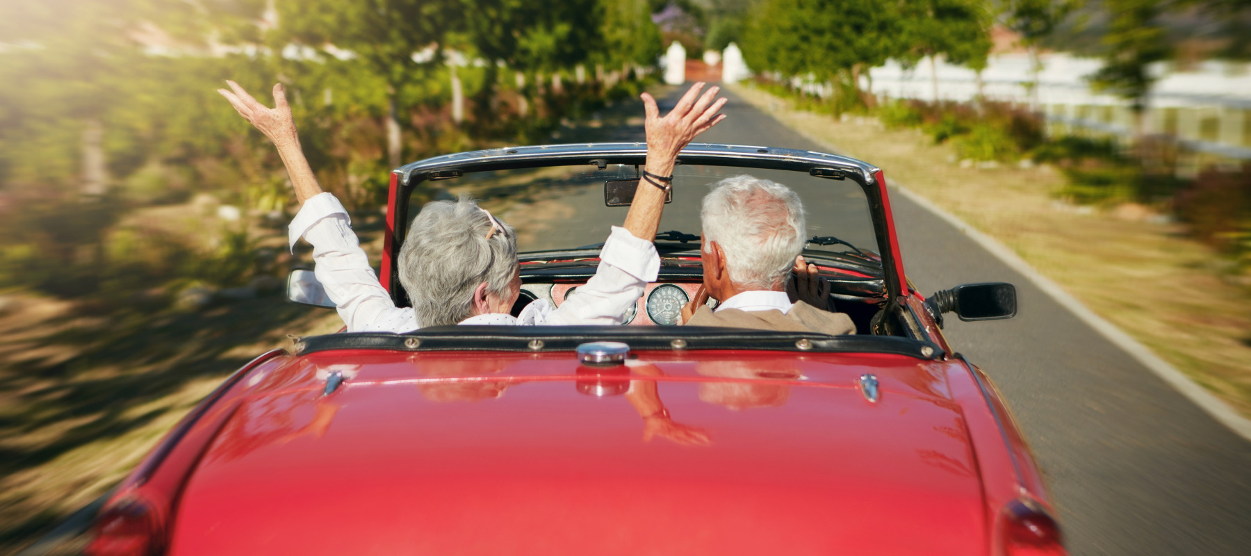 A senior couple going on a road trip.