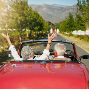 A senior couple going on a road trip.
