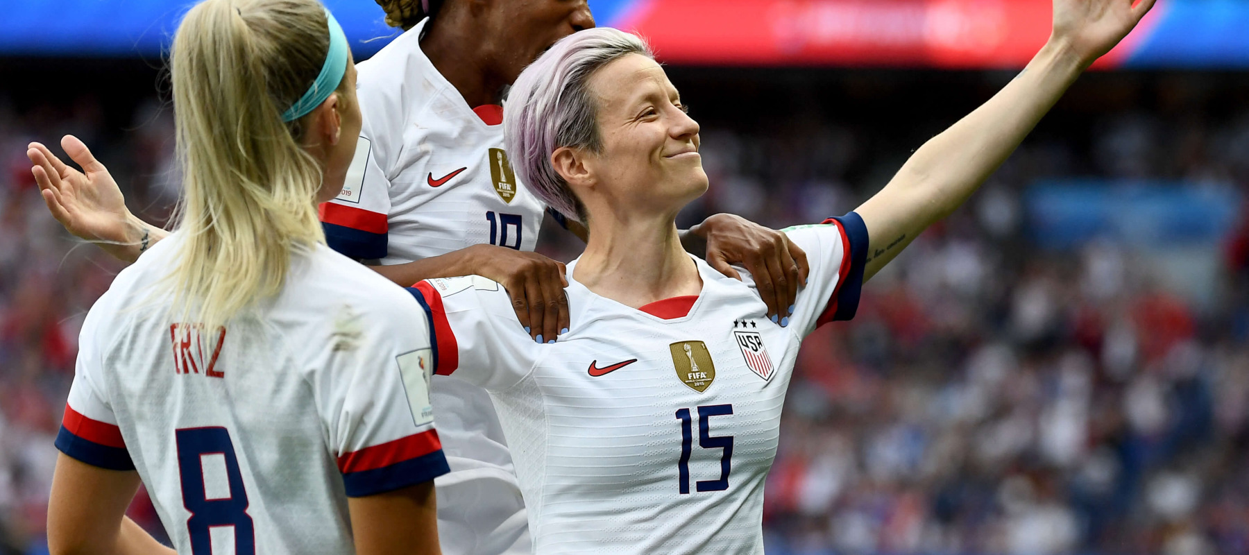 Megan Rapinoe celebrates a goal against France with her teammates.