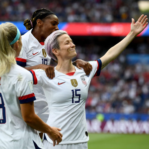 Megan Rapinoe celebrates a goal against France with her teammates.