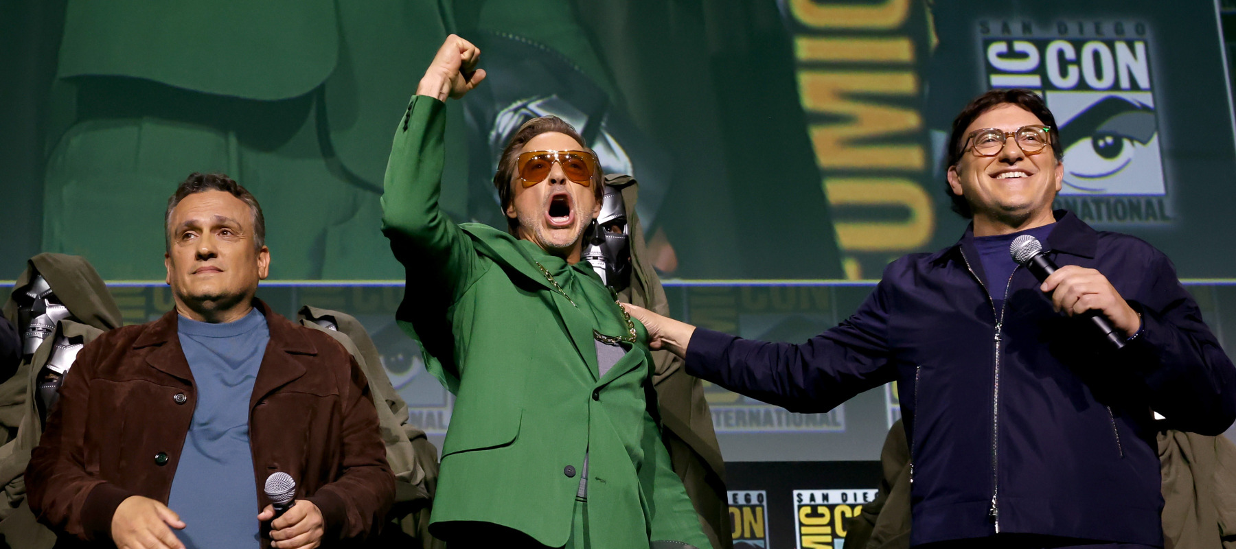 Robert Downey Jr. as Doctor Doom flanked by Joe and Anthony Russo at Comic-Con