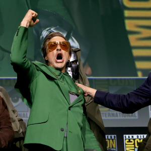 Robert Downey Jr. as Doctor Doom flanked by Joe and Anthony Russo at Comic-Con