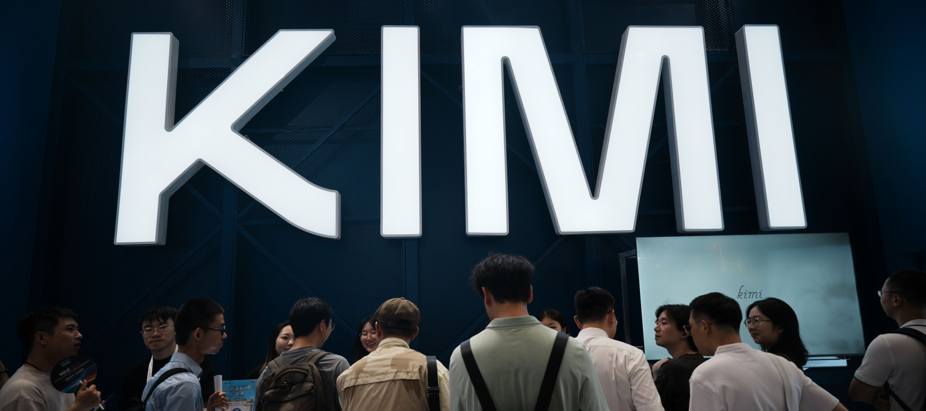 People visit the booth of Kimi, an LLM developed by the Chinese startup Moonshot, during the World AI Conference in Shanghai.