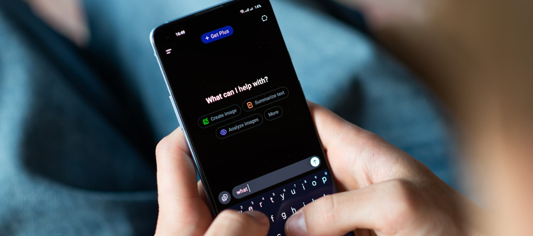 A photo of a man using ChatGPT on his phone