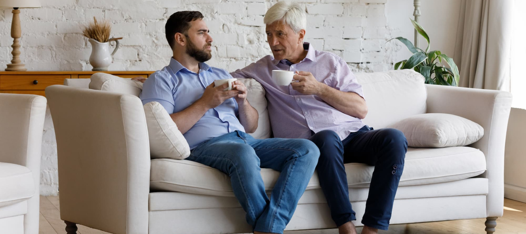 A photo of two adult males talking