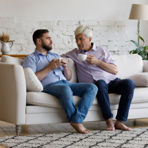 A photo of two adult males talking