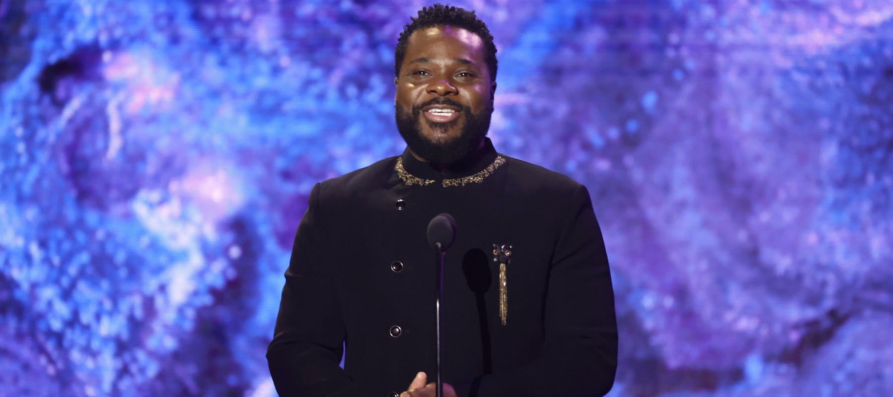 Malcolm-Jamal Warner speaks onstage during the 65th GRAMMY Awards Premiere Ceremony.