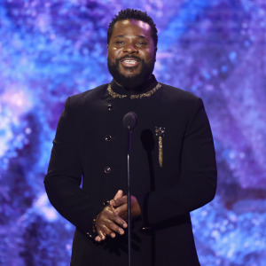 Malcolm-Jamal Warner speaks onstage during the 65th GRAMMY Awards Premiere Ceremony.