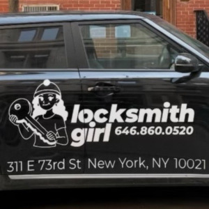 Locksmith Girl of NYC's car with business label on it next to a small image of her face