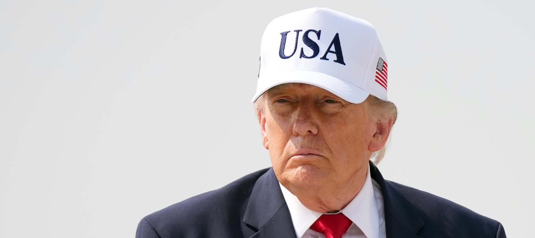 President Donald Trump walks to board Air Force One as he departs Bismarck Municipal Airport on July 1.