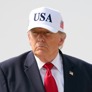 President Donald Trump walks to board Air Force One as he departs Bismarck Municipal Airport on July 1.