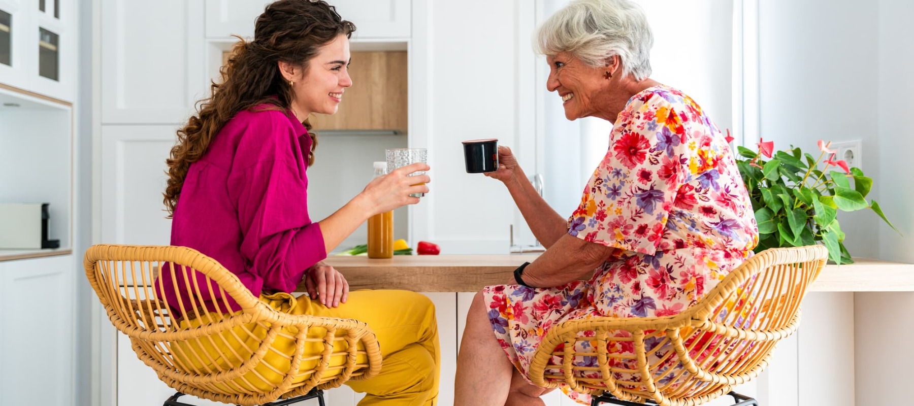 A photo of a woman drinking coffee with her grandmother